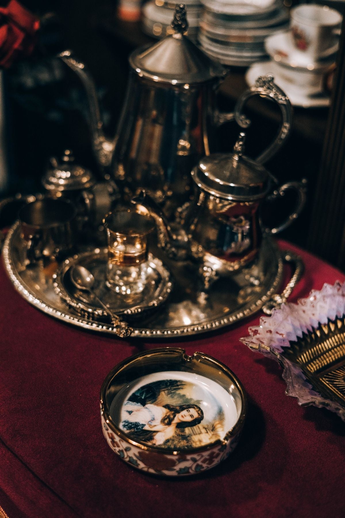 An ornate silver tea service on an engraved tray